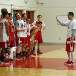 King&rsquo;s head coach Rick Skeen (right) talks to players during practice for the state quarterfinals at King&rsquo;s High School on Tuesday.