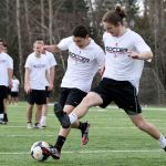 Archbishop Murphy’s Diego Rios (left) and Parker Buchanan battle for the ball during practice on Tuesday.