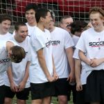 Archbishop Murphy players laugh while trying to make a team video before the start of practice on Tuesday.