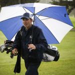 Glacier Peak golfer Justin Guffey walks with his clubs during a team practice earlier this month at Kenwanda Golf Course in Snohomish.