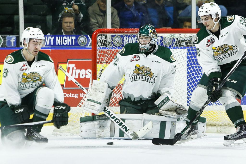 Silvertips goalie Carter Hart (center) makes a save during a game against Portland on Wednesday at Xfinity Arena in Everett.
