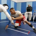 Sultan wrestler Jamell Carroll II (center) is watched by his father Jamell Carroll, Sr. during practice Tuesday at Sultan High School.