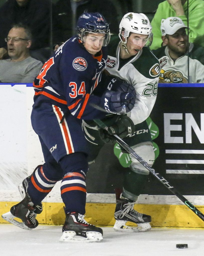 The Blazers&rsquo; Deven Sideroff (left) and the Silvertips&rsquo; Devon Skoleski vie for control of the puck during a game Friday night at Xfinity Arena in Everett.