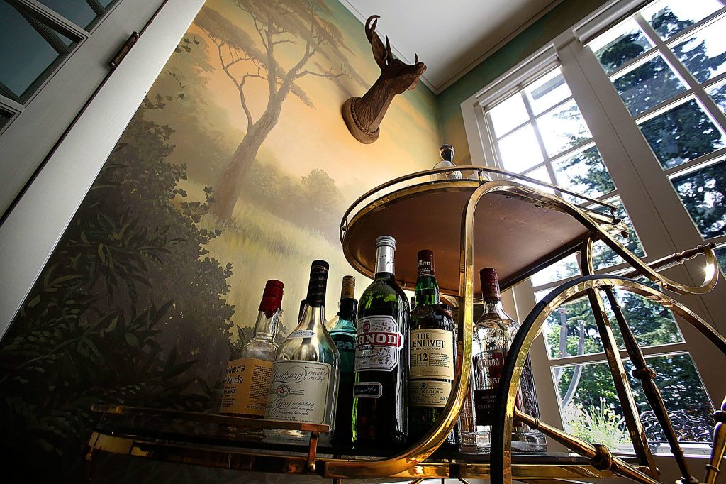 A service cart stands near a corner of the dining room, which has a one-of&mdash;a-kind mural, painted by artist Andy Eccleshall. (Dan Bates/The Herald)