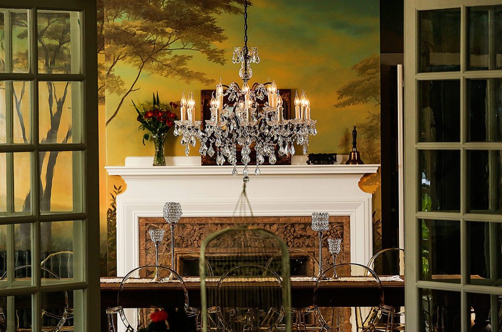 Viewed from an adjoining room, the dining room appears warm and inviting inside its wrap-around mural. (Dan Bates/The Herald)