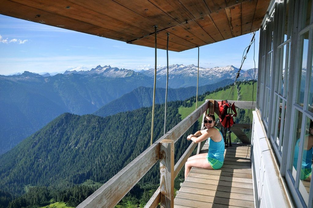 Rachel Wood relaxes at the Green Mountain Fire Lookout. (Brandon Fralic / For The Herald)