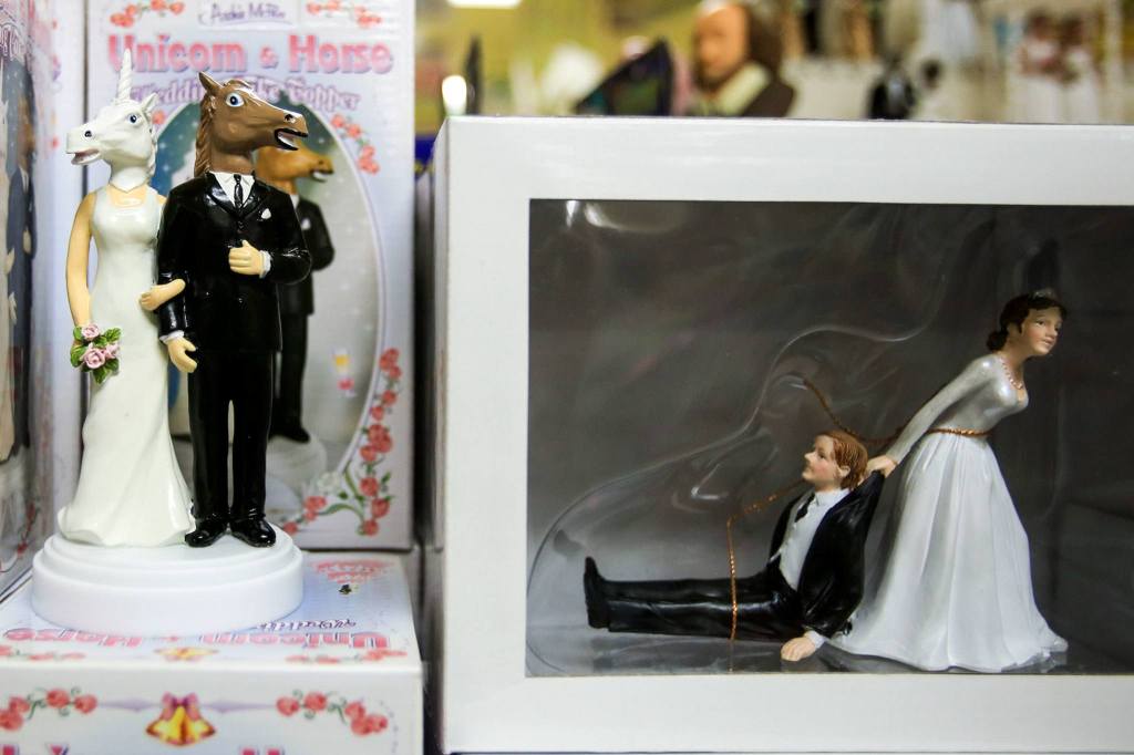 Various cake toppers decorate the shelves at Archie McPhee. (Kevin Clark / The Herald)