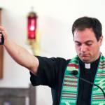 Vicar Drew Foisie starts the Paws, Prayers and Praise worship service at Saint Aidan&rsquo;s Episcopal Church on Sunday afternoon on Camano Island on Aug. 28. (Kevin Clark / The Herald)