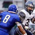 Bothell&rsquo;s Dylan Singh (left) closes in for a tackle on Glacier Peak&rsquo;s Bo Burns during a game Thursday night at Pop Keeney Stadium in Bothell. (Kevin Clark / The Herald)