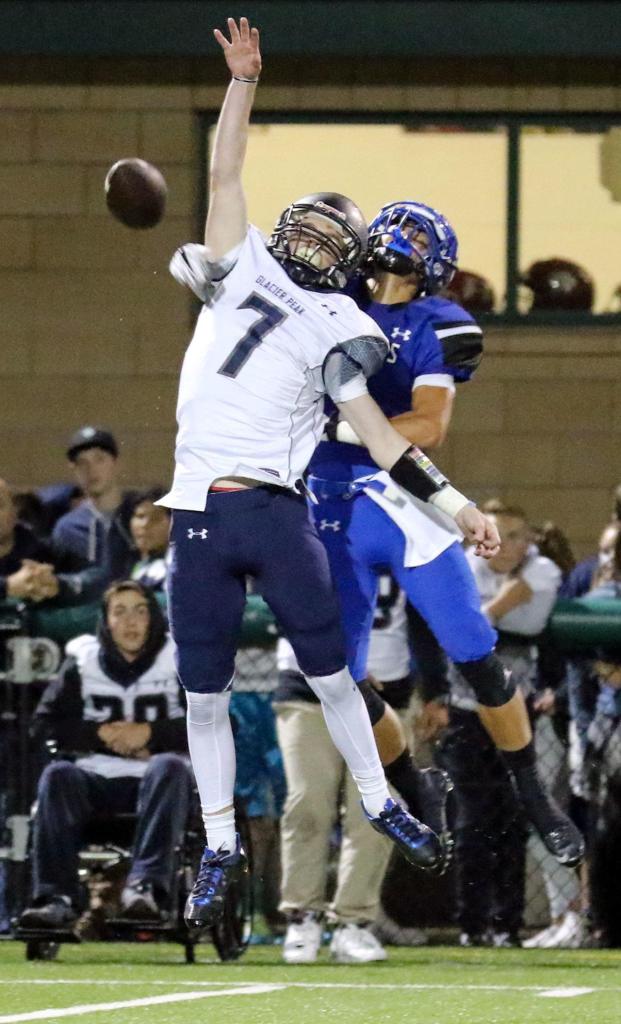Glacier Peak&rsquo;s Seiver Southard attempts a catch with Bothell&rsquo;s Kevin Liu defending during a game Thursday night at Pop Keeney Stadium in Bothell. (Kevin Clark / The Herald)