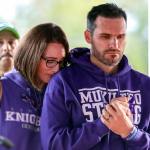 Nikki Ebner (left) and Brad Ebner stand vigil for their son, Jordan Ebner, during a memorial service before Kamiak&rsquo;s game against Bishop Blanchet Friday night at Goddard Stadium in Everett. (Kevin Clark / The Herald)