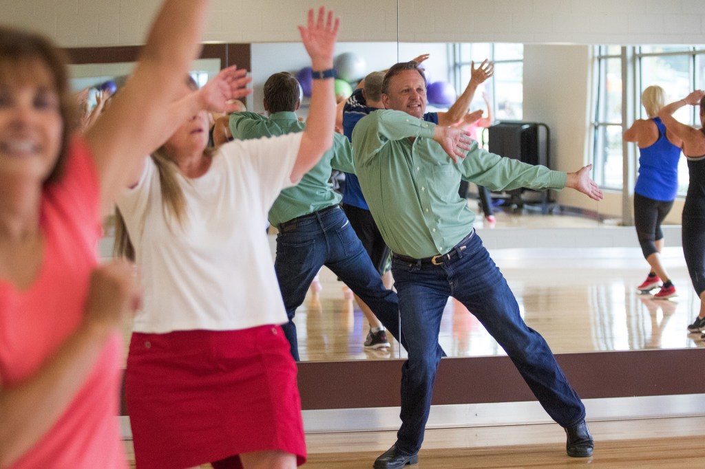 Greg Abbey, board president of the Mukilteo YMCA, dances during a zumba class at the Grand Opening of the Stanwood-Camano YMCA on Sept. 3, 2016, in Stanwood. (Andy Bronson / The Herald)