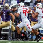 Washington&rsquo;s Dante Pettis scores on a 68-yd punt return with Rutgers&rsquo; Michael Cintron (94) and Jawuan Harris (3) trailing Saturday afternoon at Husky Stadium. (Kevin Clark / The Herald)