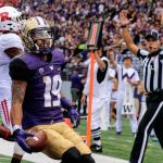 Washington&rsquo;s Andre Baccellia scores a touchdown in the third quarter against Rutgers on Saturday afternoon at Husky Stadium. (Kevin Clark / The Herald)