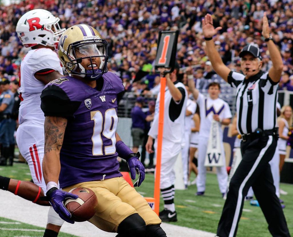 Washington&rsquo;s Andre Baccellia scores a touchdown in the third quarter against Rutgers on Saturday afternoon at Husky Stadium. (Kevin Clark / The Herald)