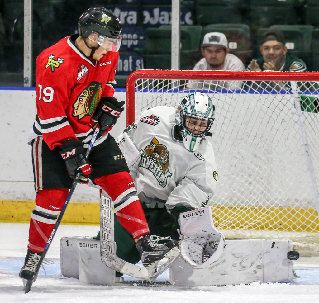 Everett&rsquo;s Lasse Petersen blocks a shot at the goal with Portland&rsquo;s Colton Veloso looking on Sunday night at Xfinity Arena in Everett. (Kevin Clark / The Herald)