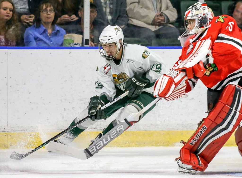 Everett&rsquo;s Bryce Kindopp controls the puck with Portland&rsquo;s Cole Kehler defending Sunday night at Xfinity Arena in Everett. (Kevin Clark / The Herald)