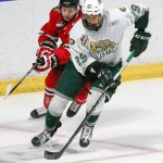 Everett&rsquo;s Wyatte Wylie controls the puck under pressure from Portland&rsquo;s Bronson Sharp during Sunday night&rsquo;s game at Xfinity Arena. (Kevin Clark / The Herald)