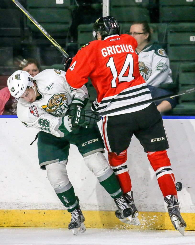 Everett&rsquo;s Kevin Davis collides with Portland&rsquo;s Jake Gricius during Sunday night&rsquo;s preseason game at Xfinity Arena in Everett. (Kevin Clark / The Herald)