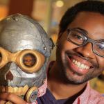 Samuel Hightower runs the 3D Buildtower kiosk at the Everett Mall. (Kevin Clark / The Herald)