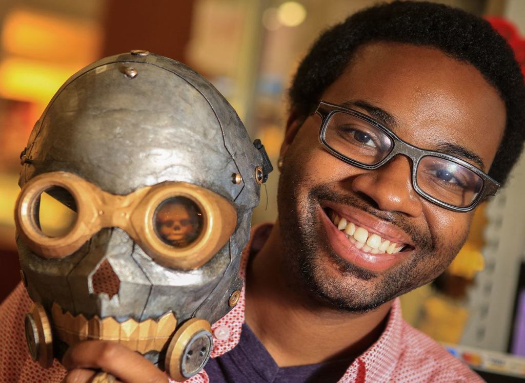 Samuel Hightower runs the 3D Buildtower kiosk at the Everett Mall. (Kevin Clark / The Herald)
