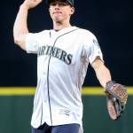Silvertips goaltender Carter Hart throws out the ceremonial first pitch before the Mariners game against the Rangers on Wednesday night at Safeco Field in Seattle. (Kevin Clark / The Herald)