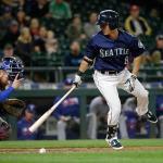 The Mariners&rsquo; Norichika Aoki (right) looks back after striking out as Rangers catcher Jonathan Lucroy looks for the loose ball in the eighth inning of a game Tuesday in Seattle. (AP Photo/Elaine Thompson)