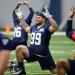 The Seahawks&rsquo; Taniela Tupou, an Archbishop Murphy alum, stretches during a rookie minicamp workout May 8 in Renton. (AP Photo/Elaine Thompson)