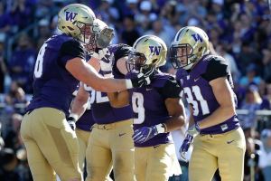 Browning tosses 5 TDs, No. 8 Washington routs Idaho 59-14