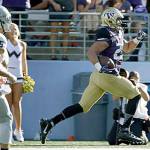 Washington&rsquo;s Connor O&rsquo;Brien (right) returns an interception for a touchdown during the second half of the Huskies 59-14 win over Idaho on Sept. 10 in Seattle. (AP Photo/Ted S. Warren)