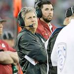 Washington State coach Mike Leach, shown here during the Cougars&rsquo; game against Eastern Washington on Sept. 3, has complained that the media and local police are unfairly focusing on the actions of his football players. (AP Photo/Young Kwak)