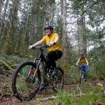 Hannah Mendro (left) and Nicholle Ayres, with the Lakewood-Arlington Cycling Club Mountain Bike Team make their way down a small section of trail in March of 2012. (Jennifer Buchanan / Herald file photo)