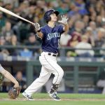 Seattle&rsquo;s Nori Aoki hits a solo home run on a pitch from Oakland&rsquo;s Raul Alcantara during the second inning of the Mariners&rsquo; 5-1 win over the the Athletics on Friday in Seattle. (AP Photo/John Froschauer)