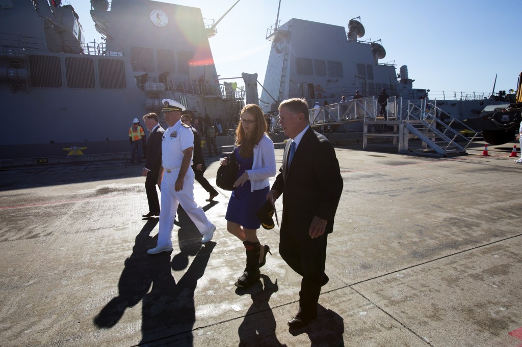 Everett Mayor Ray Stephenson, right, walks past the USS Sampson (DDG 102) after boarding and meeting with officers and crew at Naval Station Everett on Monday. (Andy Bronson / The Herald)