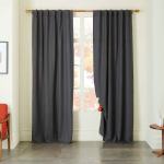 Combine different tones and finishes: You want to vary the shades and sheen of black in a home. Pictured, Belgian Flax Linen Curtain in slate ($129-$179, westelm.com). (West Elm)