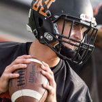 Monroe quarterback Zach Zimmerman drops back to pass during practice Thursday afternoon at Monroe High School. (Kevin Clark / The Herald)
