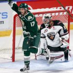 Everett&rsquo;s Matt Fonteyne celebrates his goal past the Giants&rsquo; Ryan Kubic in the second period of a game Saturday at Xfinity Arena in Everett. (Kevin Clark / The Herald)