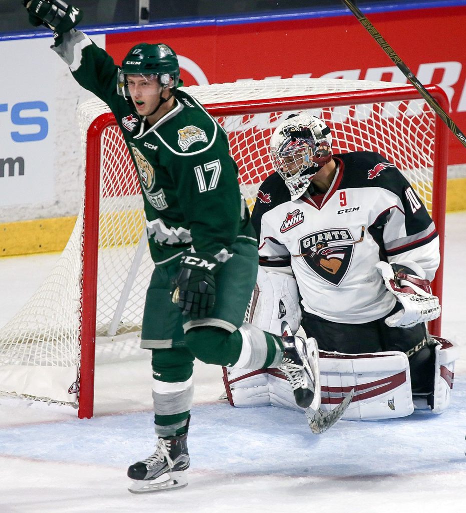 Everett’s Matt Fonteyne celebrates his goal past the Giants’ Ryan Kubic in the second period of a game Saturday at Xfinity Arena in Everett. (Kevin Clark / The Herald)