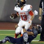 Monroe&rsquo;s Isaiah Cole fights for the end zone and the touchdown with Glacier Peak&rsquo;s Sean Bad attempting a stop Friday night at Veterans Memorial Stadium in Snohomish. (Kevin Clark / The Herald)