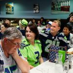 Lori Hammond (center #3) was the only club member wearing the new Action Green jersy at Tuesday night&rsquo;s Snohomish County Sea Hawkers Booster Club meeting and dinner at Shawn O&rsquo;Donnell&rsquo;s. (Dan Bates / The Herald)