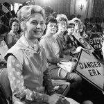 In this Aug. 10, 1976, photo, women opposed to the Equal Rights Amendment sit with Phyllis Schlafly, left, national chairman of Stop ERA, at hearing of Republican platform subcommittee on human rights and responsibilities in a free society in Kansas City, Missouri. (AP Photo)