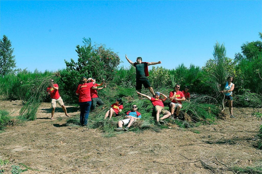 More than 30 employees from Fluke Corp. held a &ldquo;Lend the Sand a Hand&rdquo; volunteer event Aug. 20 to help clean Jetty Island of trash and invasive Scotch broom plants. (Contributed photo)