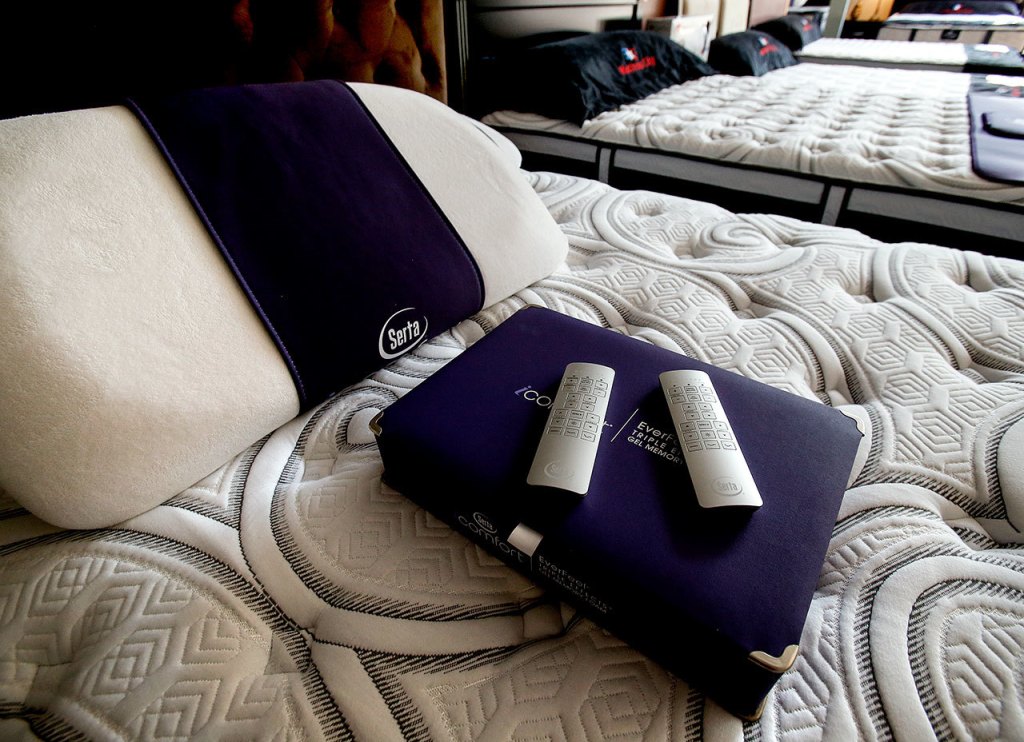 Many of the high-end beds offered at Mattress City have incorporated high-tech comfort options, even his and her remotes. (Dan Bates / The Herald)
