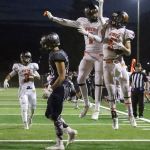 Monroe&rsquo;s Jason Cyr celebrates with teammate Blake Bingham after a touchdown with Glacier Peak&rsquo;s Heston Pettis walking away Friday night at Veterans Memorial Stadium in Snohomish. (Kevin Clark / The Herald)