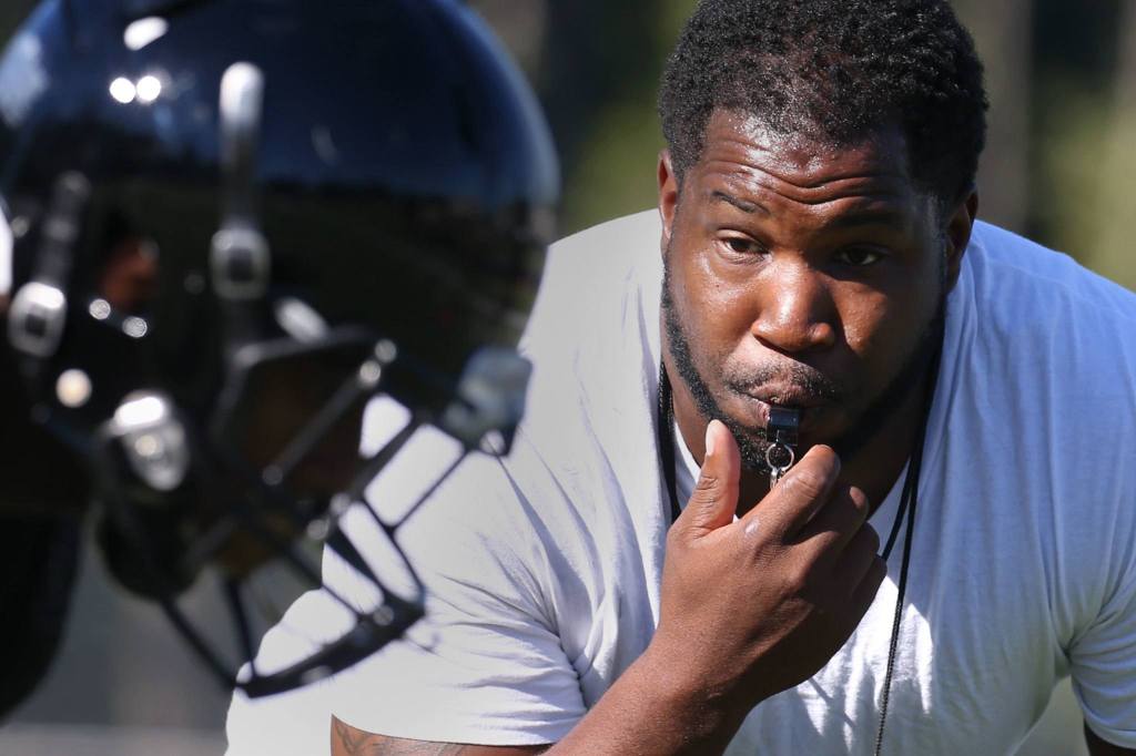 Lynnwood head coach Keauntea Bankhead blows his whistle during practice Wednesday afternoon at Lynnwood High School in Bothell. (Kevin Clark / The Herald)