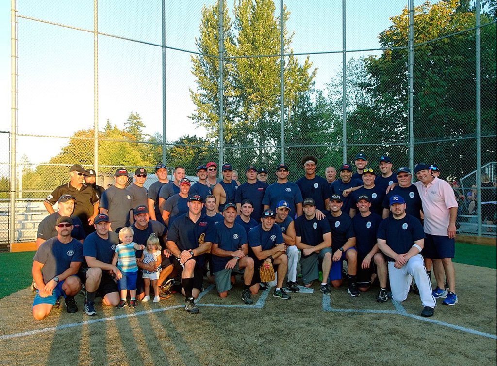 Lake Stevens police officers and firefighters competed in an annual Guns &lsquo;n&rsquo; Hoses charity softball game Aug. 18. Fire won the game, 16-9. (Contributed photo)