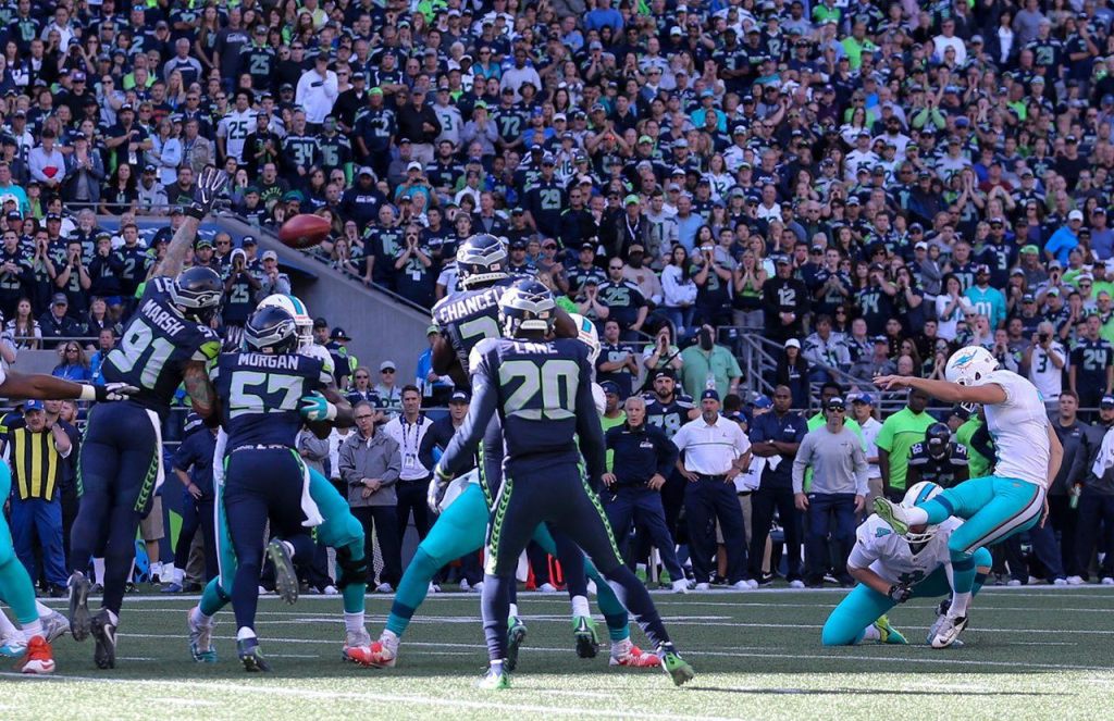 Seahawks defensive lineman Cassius Marsh blocks a field-goal attempt by Dolphins kicker Andrew Franks early in the fourth quarter Sunday at CenturyLink Field in Seattle. (Kevin Clark / The Herald)