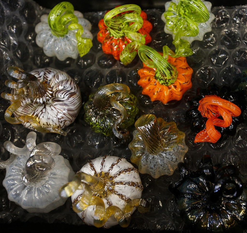 Handmade glass pumpkins are seen at the Schack Art Center in Everett. (Ian Terry / The Herald)