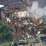 In this frame from video, smoke rises from a house that exploded in the Bronx borough of New York on Tuesday. Authorities said firefighters responded to a report of a gas leak right before the house exploded. (WABC-TV via AP)