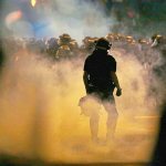 Police fire teargas as protestors converge on downtown following Tuesday&rsquo;s police shooting of Keith Lamont Scott in Charlotte, North Carolina, on Wednesday. (AP Photo/Gerry Broome)